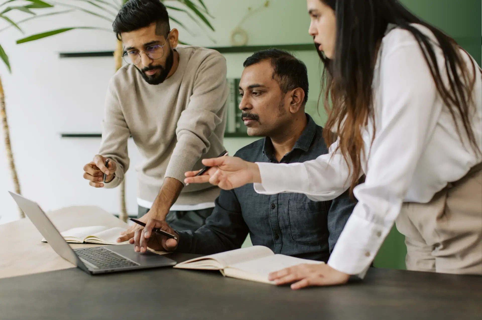 IT team meeting with a client to understand their needs and create custom technology solutions.